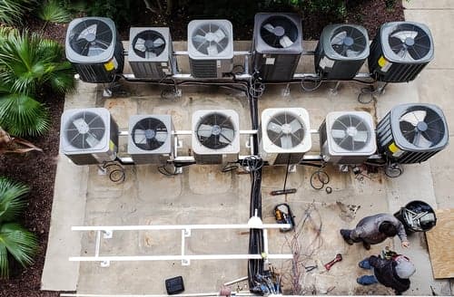 HVAC technicians installing residential condenser units in Concord, California